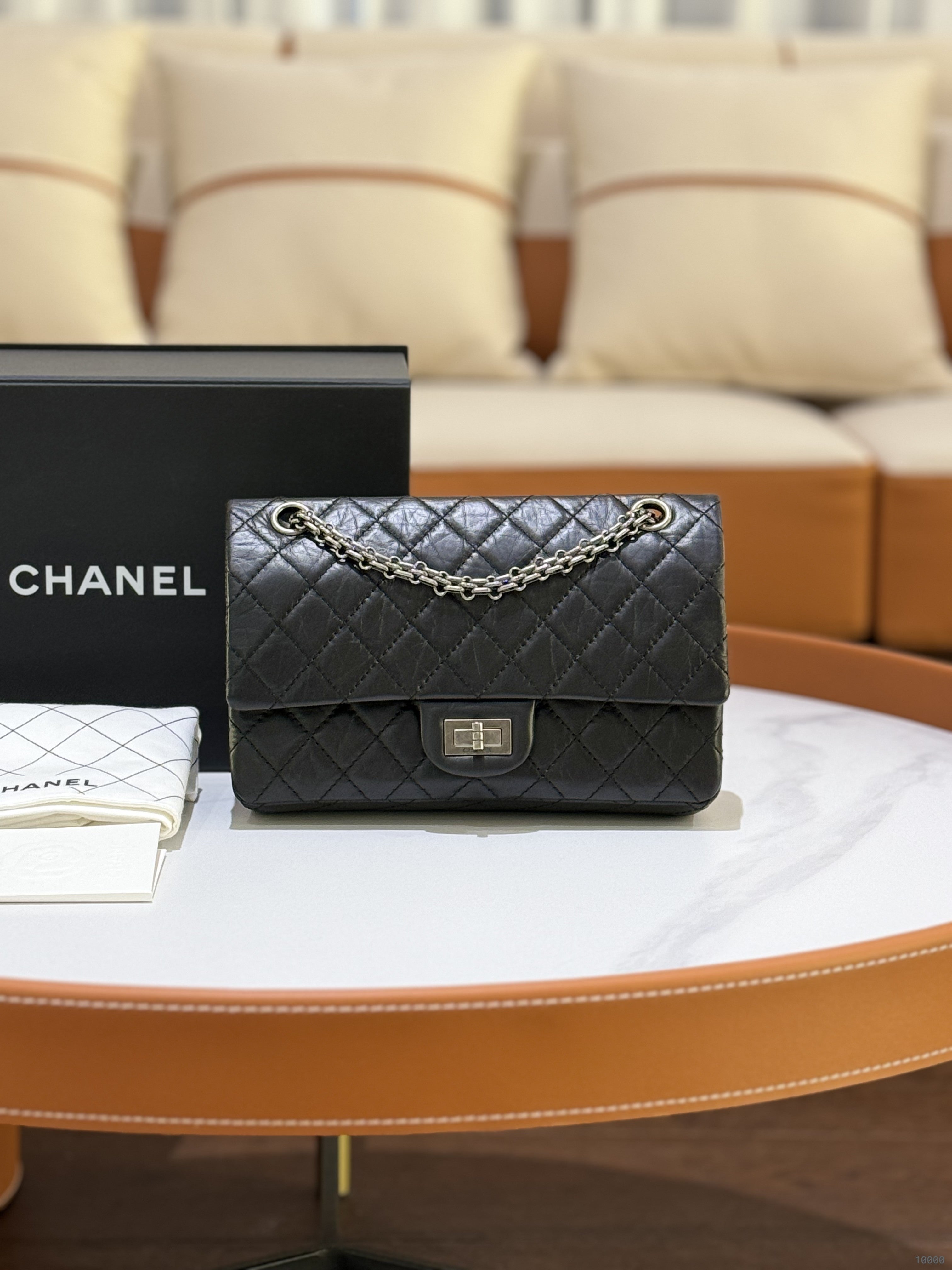 CHANEL 2.55 BLACK WITH SILVER HARDWARE AND CHIP | COLLINS RAIN