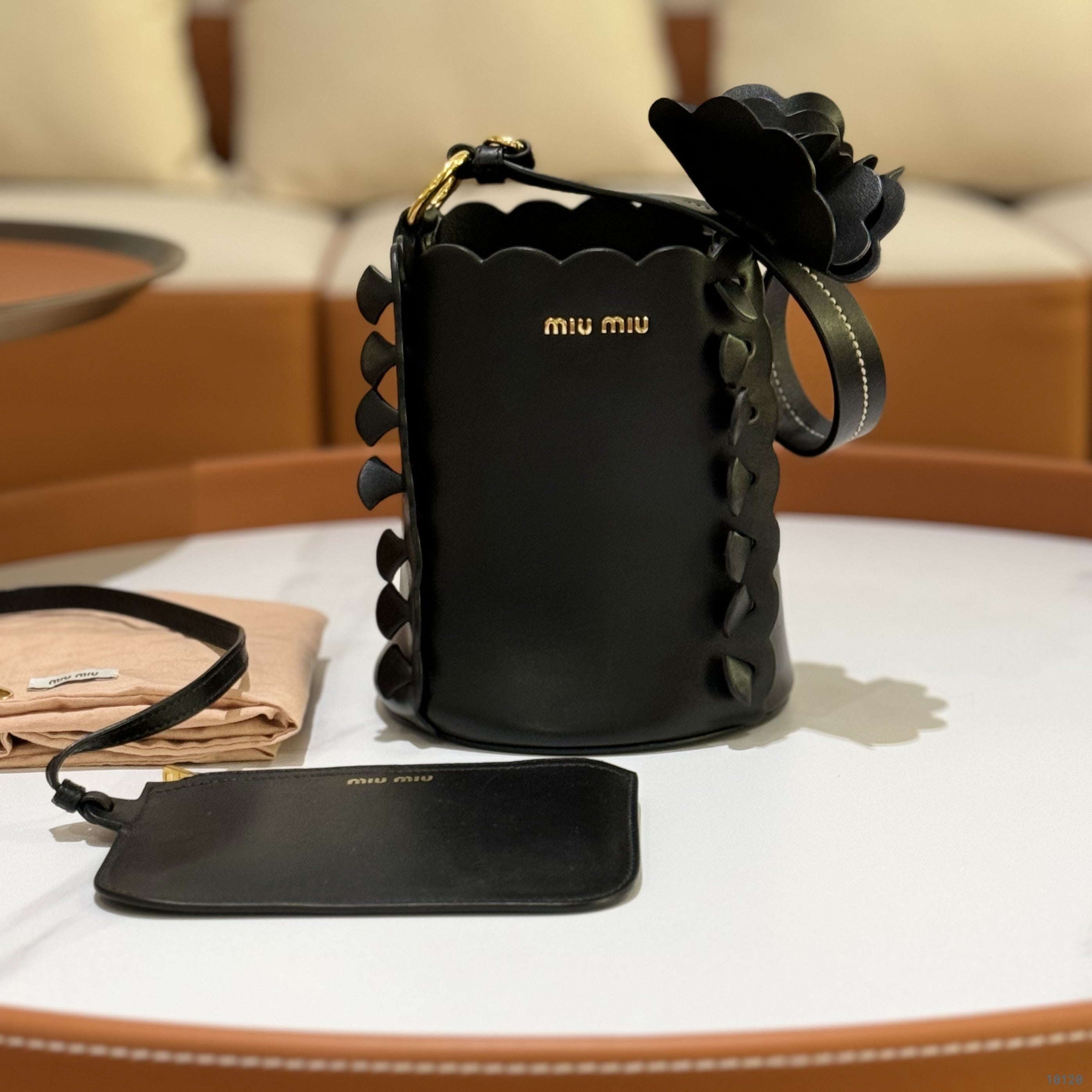 MIUMIU BLACK FLOWER BUCKET BAG | COLLINS RAIN