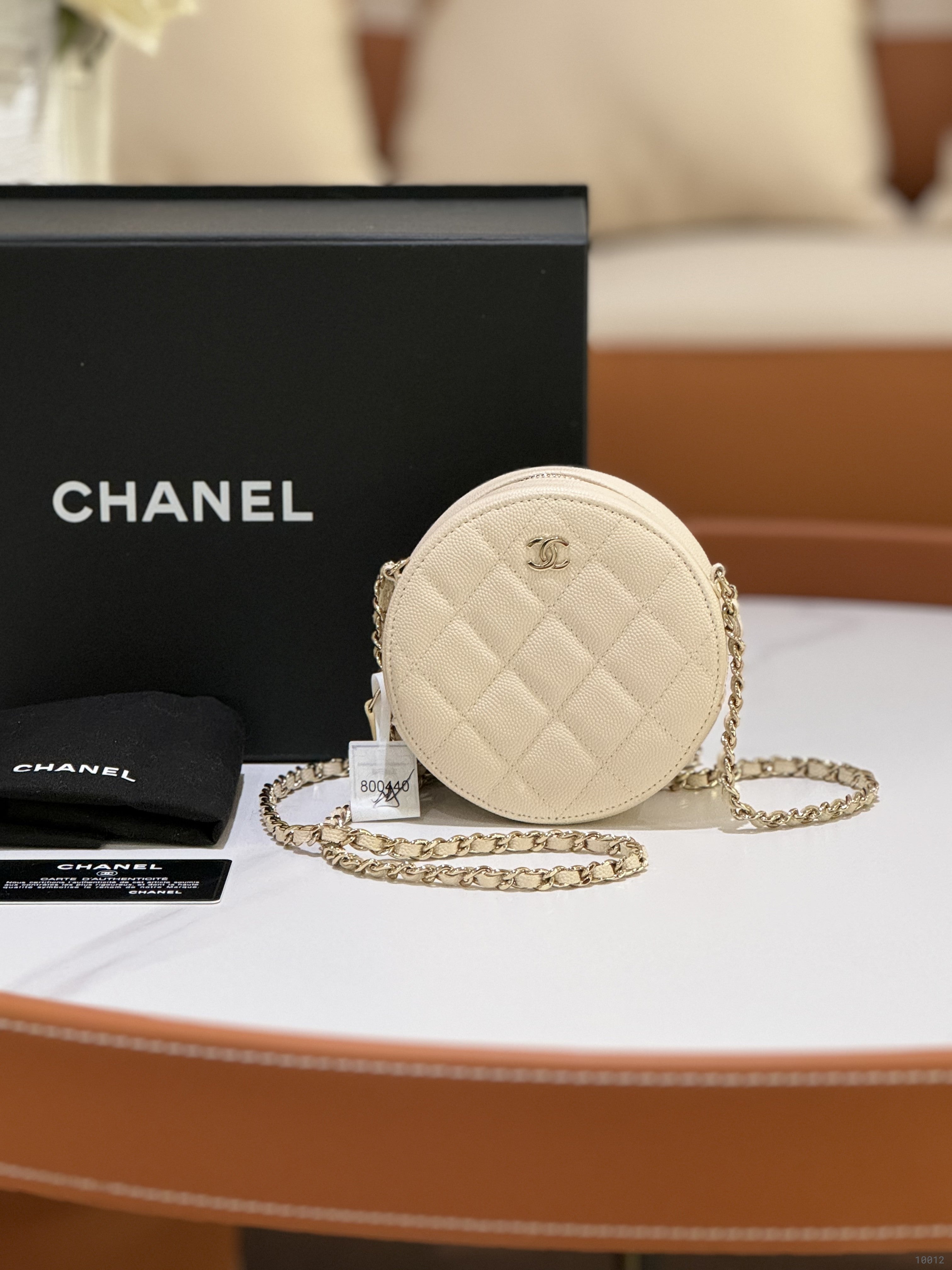 CHANEL ROUND CAKE BAG WHITE CALFSKIN WITH GOLD CHAIN | COLLINS RAIN