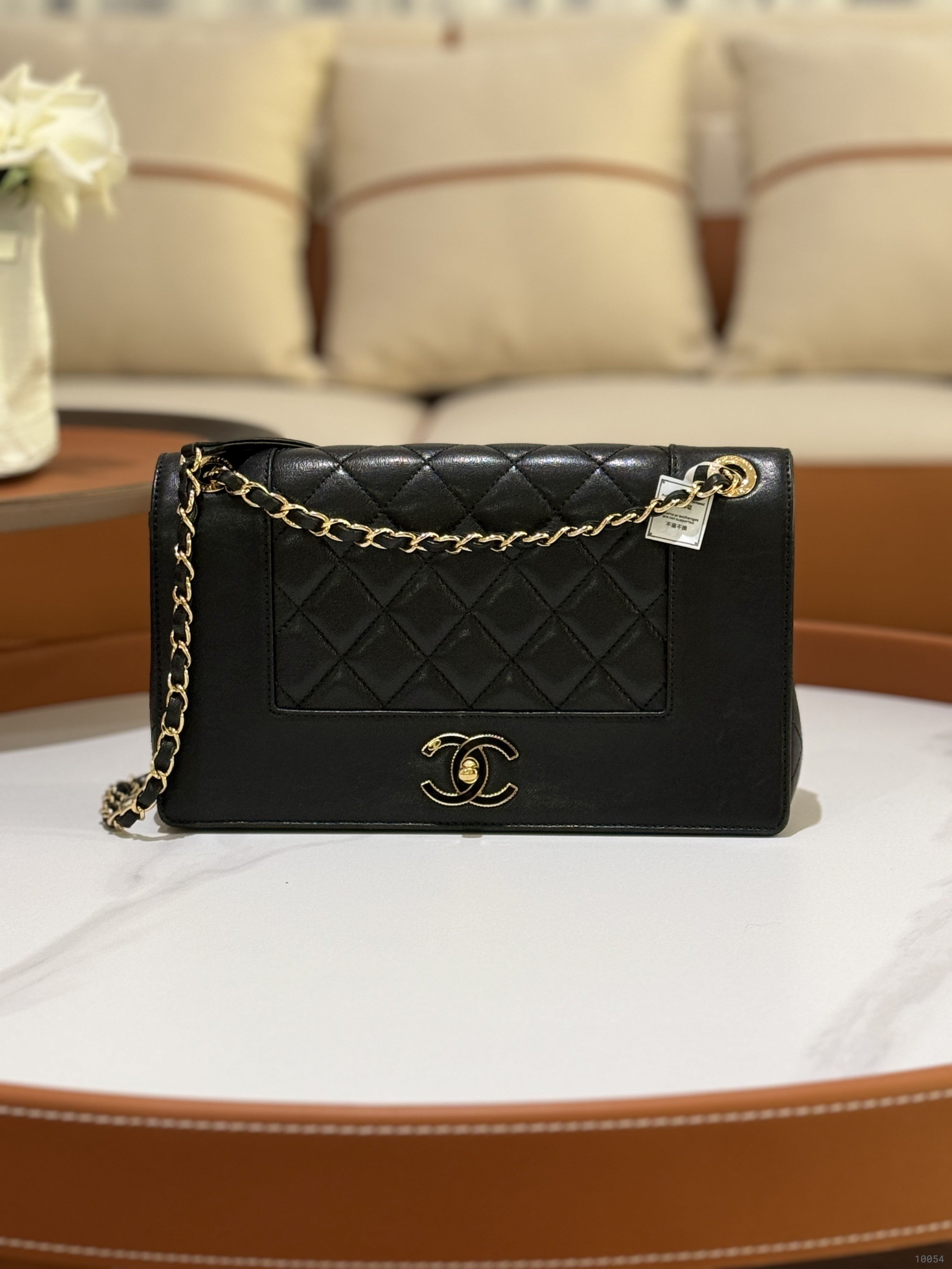 CHANEL BLACK FLAP BAG | COLLINS RAIN