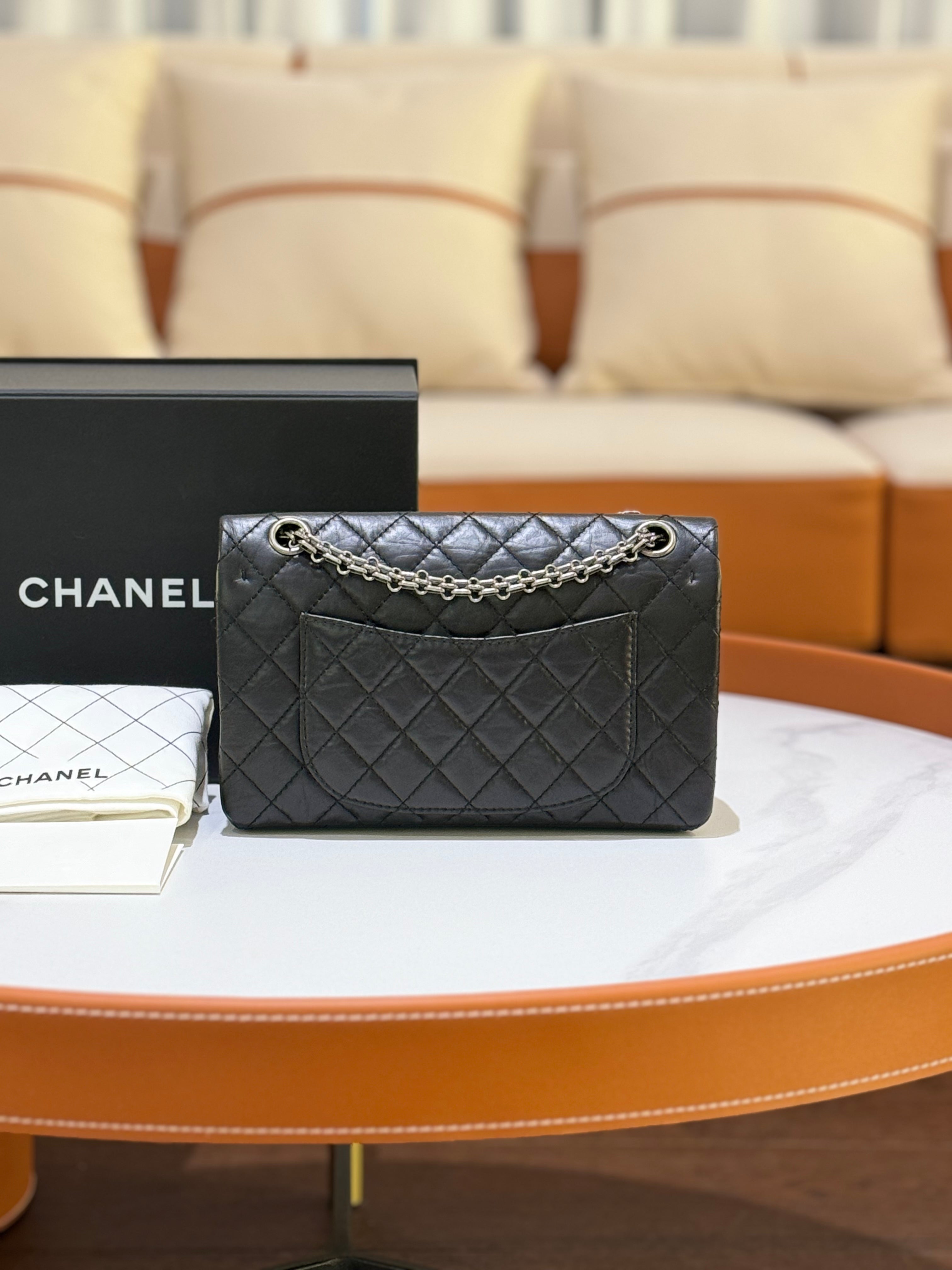 CHANEL 2.55 BLACK WITH SILVER HARDWARE AND CHIP | COLLINS RAIN