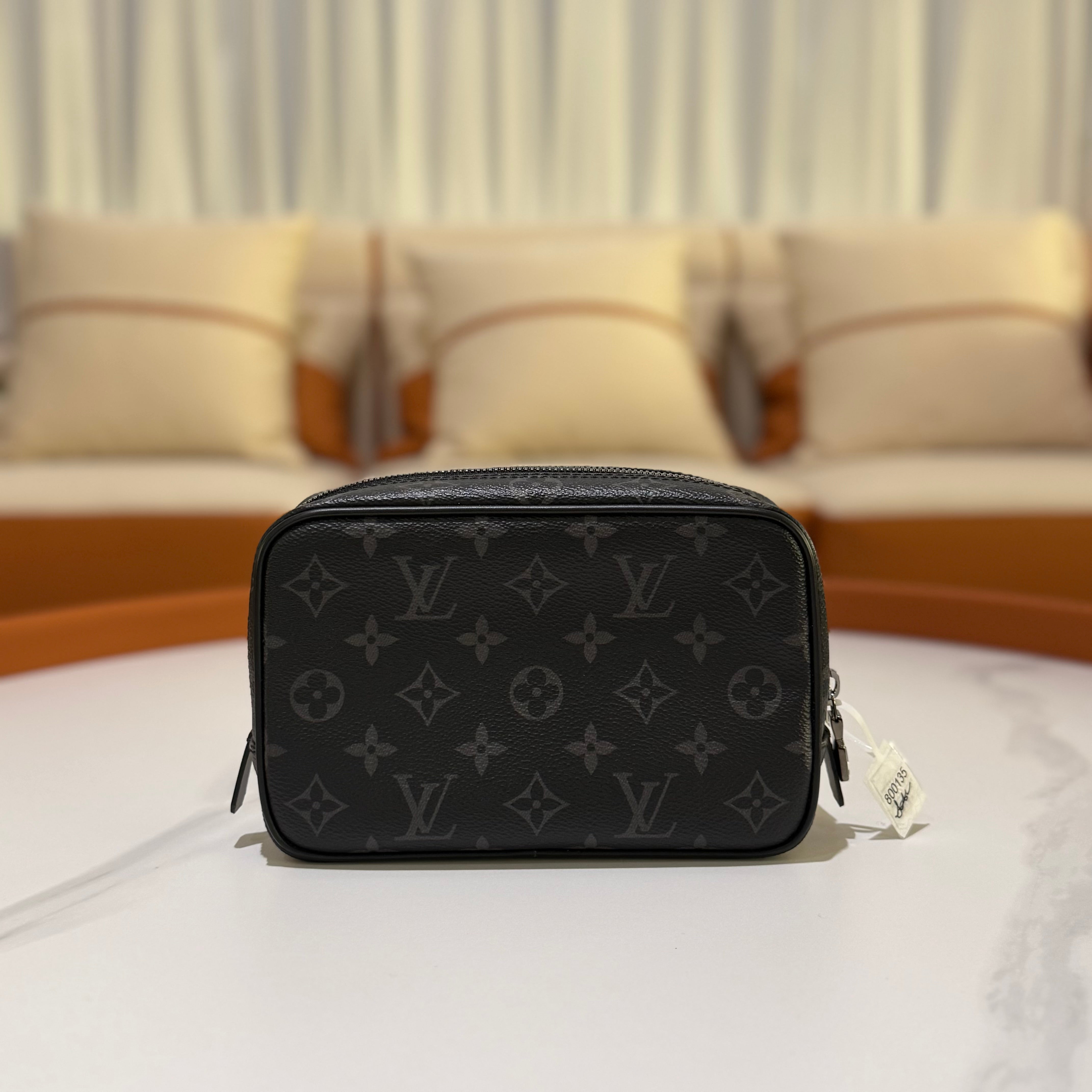 LOUIS VUITTON BLACK FLOWER HANDHELD TOILETRY BAG