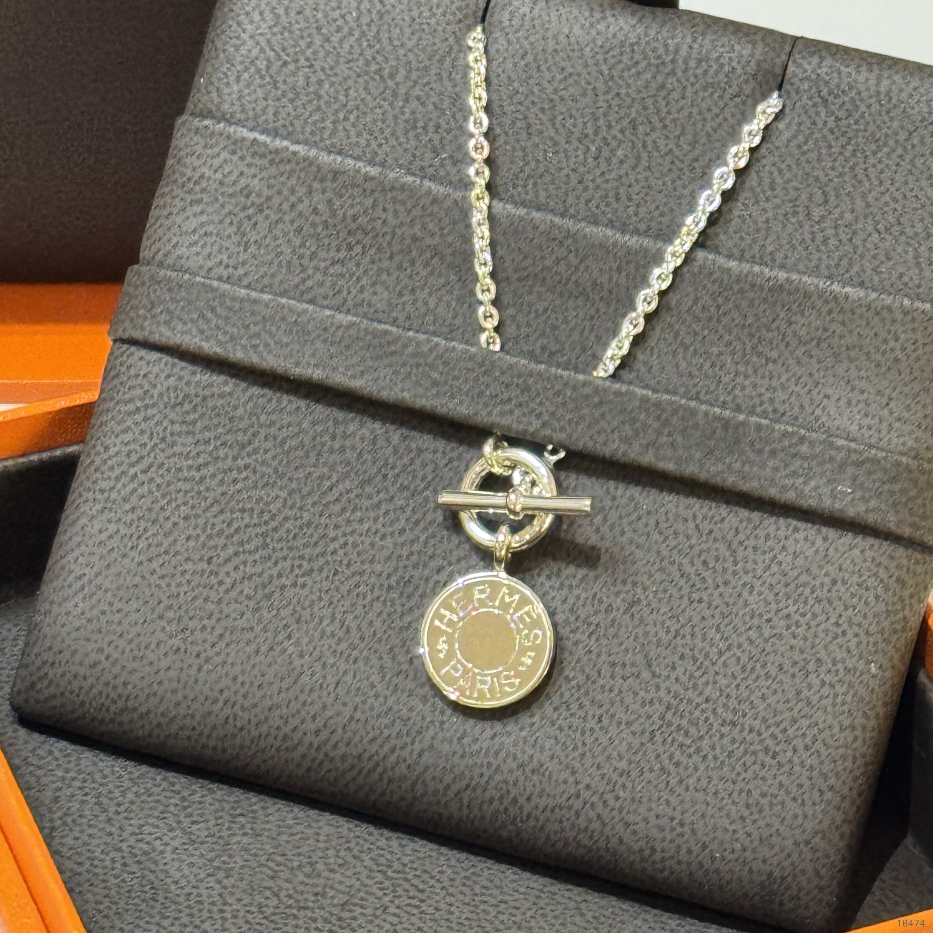 HERMES SILVER BADGE NECKLACE