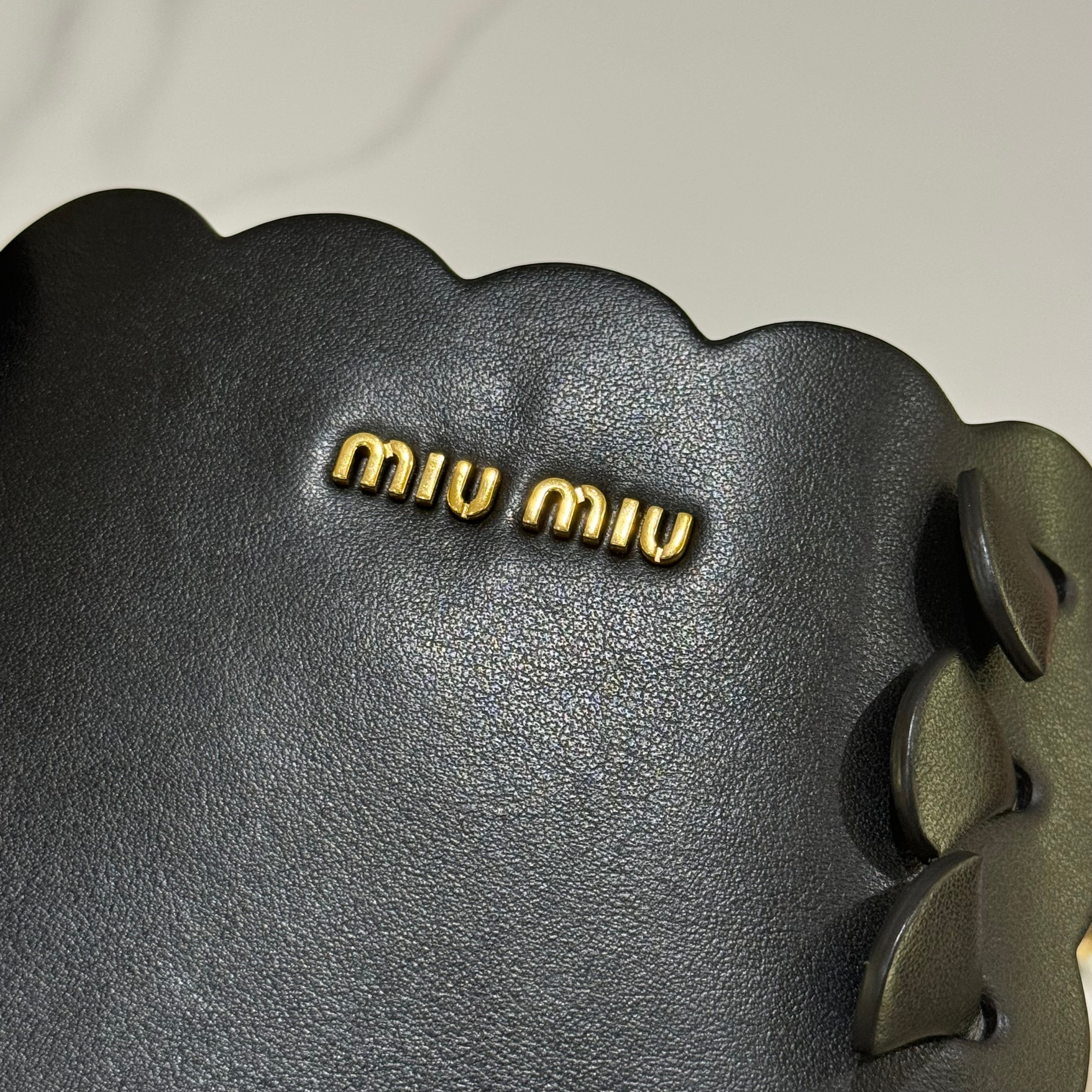 MIUMIU BLACK FLOWER BUCKET BAG | COLLINS RAIN