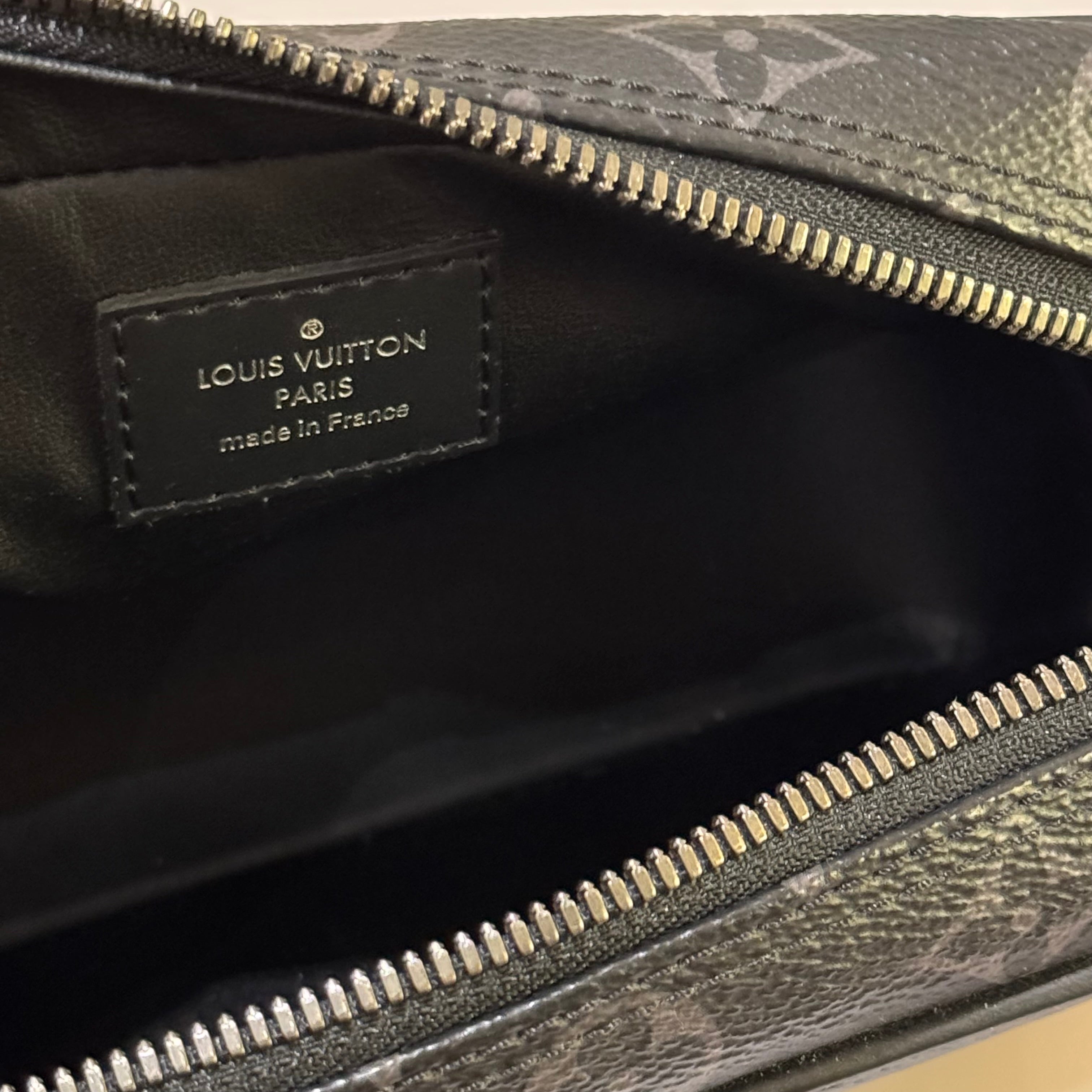 LOUIS VUITTON BLACK FLOWER HANDHELD TOILETRY BAG