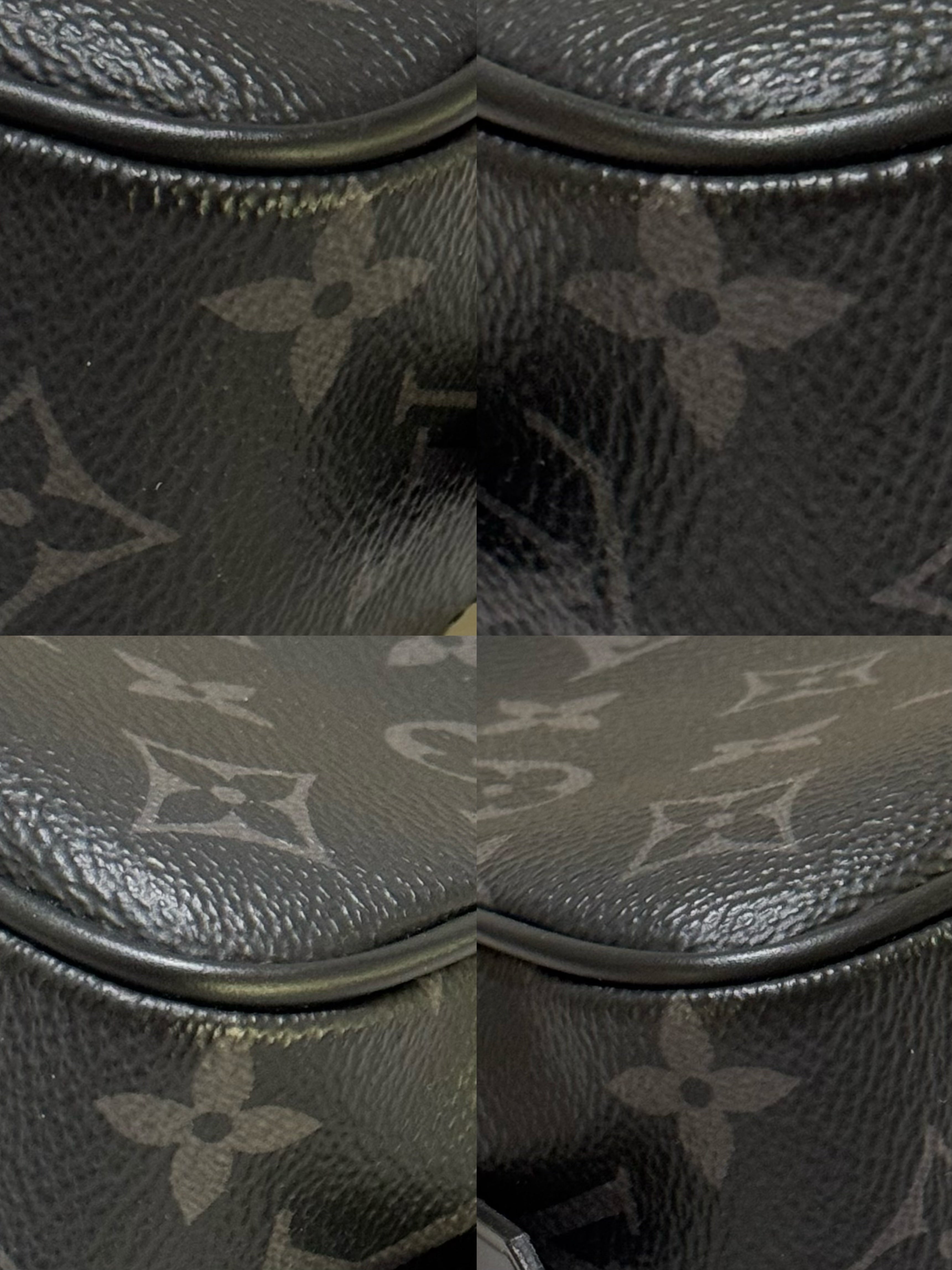 LOUIS VUITTON BLACK FLOWER HANDHELD TOILETRY BAG